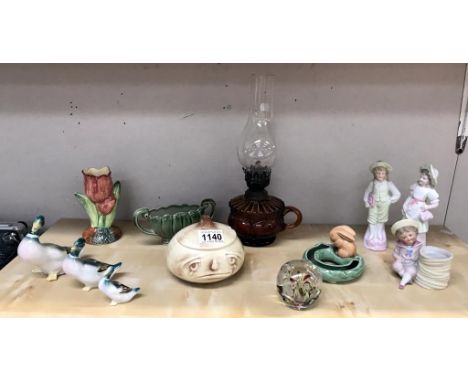 An amber glass finger oil lamp, bisque figures, Wade and Sylvac china, graduated ducks etc.