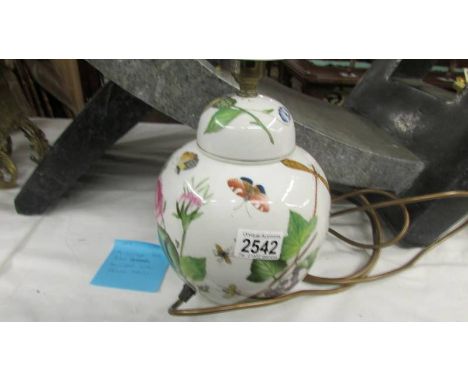 A vintage Portmerion table lamp decorated with insects.