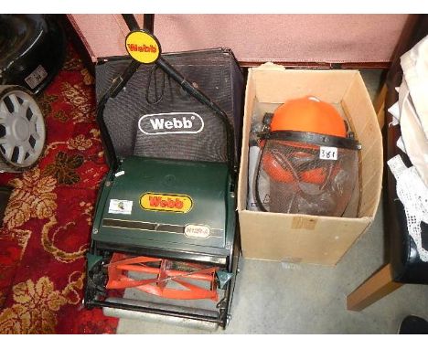 A good Webb manual mower, guard hat and other tools.