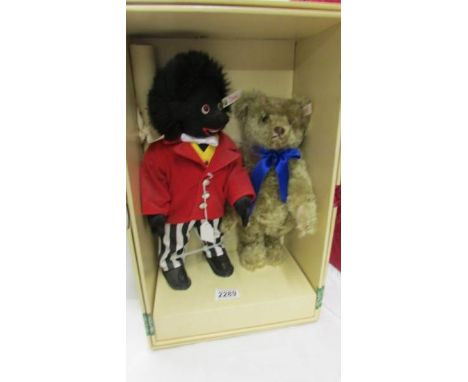 A Steiff Jolly Golly and Bear set in original box.