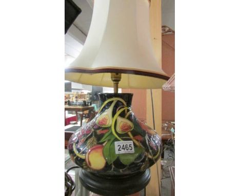 A Moorcroft table lamp with shade.