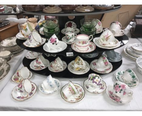 A quantity of porcelain trio's &amp; cups &amp; saucers including Royal Albert etc.
