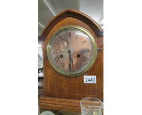 A mahogany inlaid 8 day bracket clock.