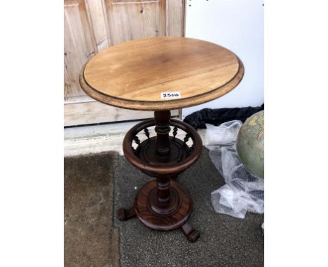 A Victorian circular mahogany lamp table with bobbin turned needlework gallery, on circular base painted to simulate rosewood