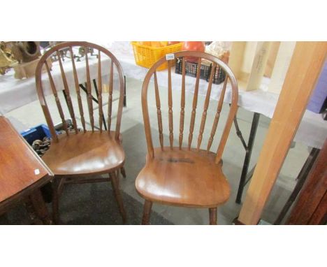 A pair of Ercol style kitchen chairs.