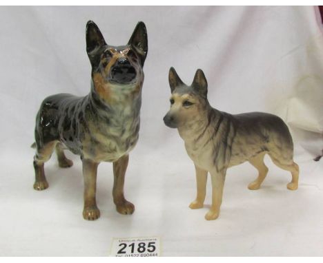 A Goebel Alsation dog and one other.