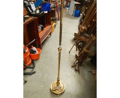A brass standard lamp.
