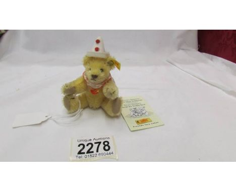A Steiff miniature clown bear.