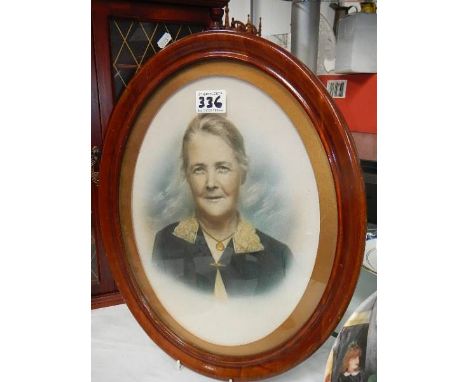 A 1920's portrait of an old lady in oval frame.