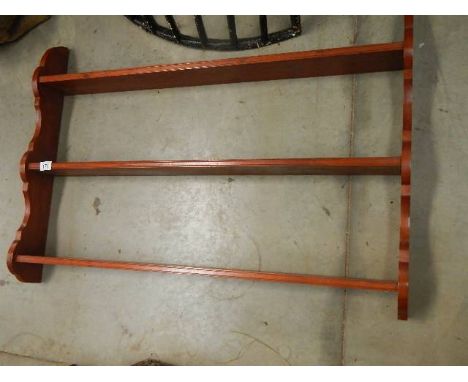A mahogany wall shelf unit.