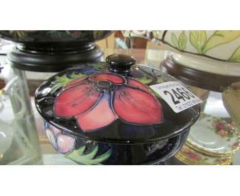 A Moorcroft lidded powder bowl.