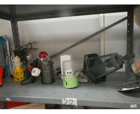 A shelf of assorted lamps.