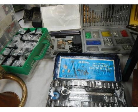 Four boxes of tools including drills, grinder, socket set etc.,