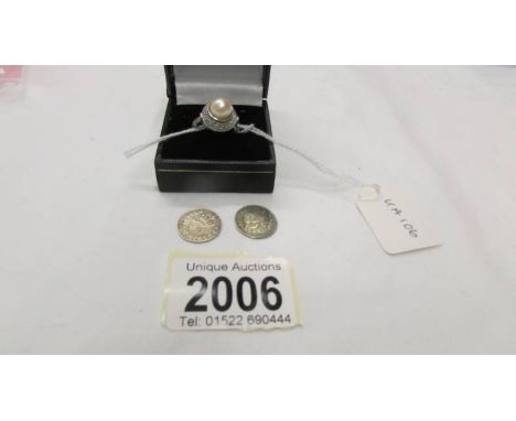 A silver ring size N half and two silver threepenny bits.
