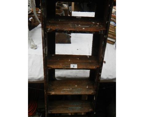 An old wooden step ladder.