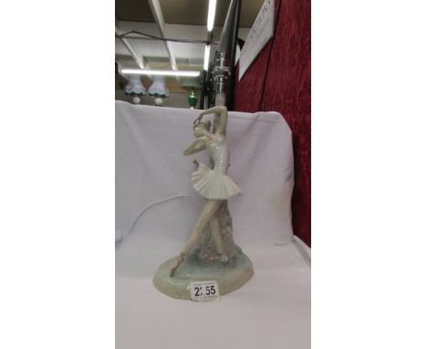 A Lladro ballerina table lamp base. ****Condition report**** Roughness to glaze under light fitting otherwise no damage, wiri