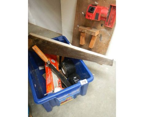 A box of tools and a drill sharpener.
