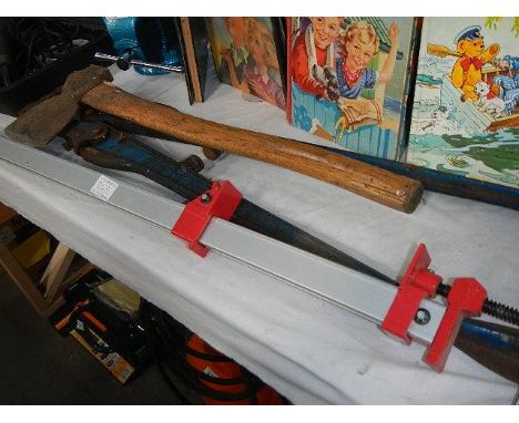 A mixed lot of tools including new clamps, bolt cutters, axe etc.,