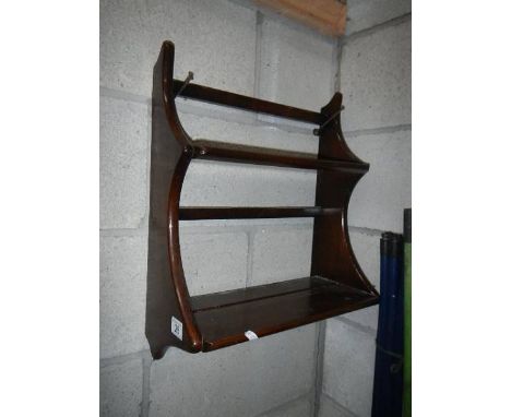 A small Ercol shelf unit, 42 x 28 x 21 cm.