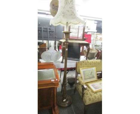 A good quality wooden standard lamp with shade.