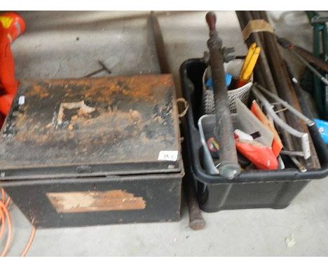 A tin box of tools and one other.