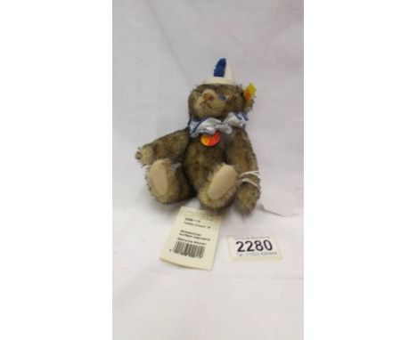 A small Steiff clown bear.
