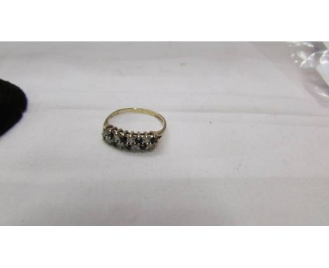 A 9ct gold ring set 8 white and 8 blue stones, size J.