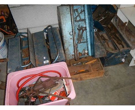 4 metal tool boxes and a large quantity of tools.
