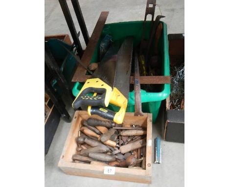 Two boxes of old tools including saws.