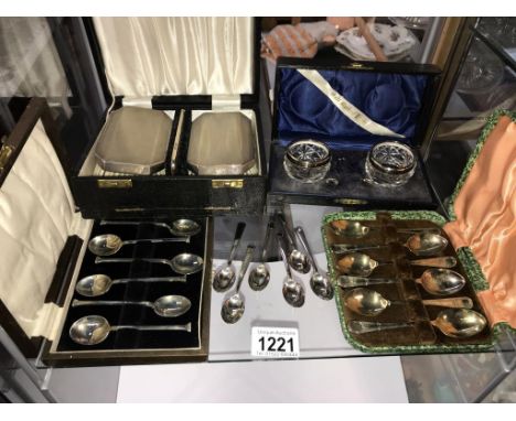 A cased silver rimmed condiment set &amp; spoons, a cased silver backed 2 brush &amp; comb set, &amp; cased silver plate spoo