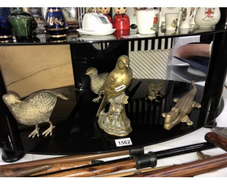 A quantity of brass animals including solid brass bird, crocodile nut cracker etc