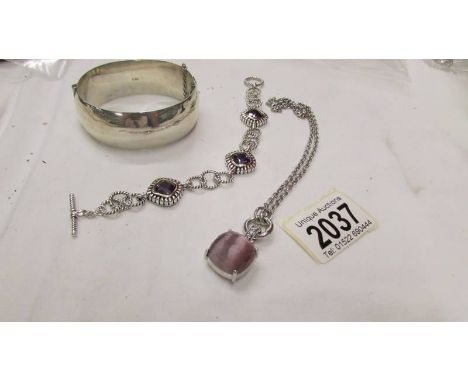 A silver bracelet stamped set with purple stones together with a wide silver vintage bangle and an Italian silver stone set p