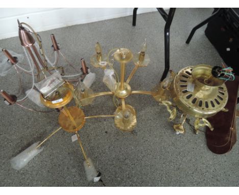 Four large brass effect light fittings