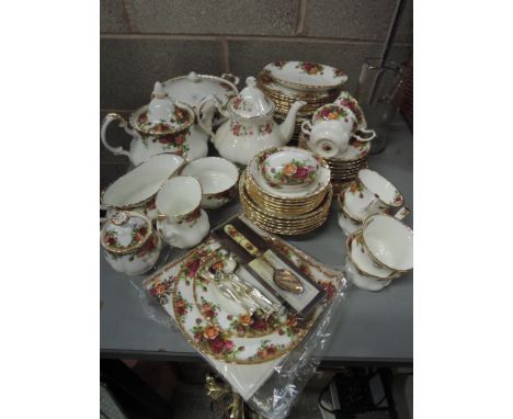 A Royal Albert Old Country Roses dinner service, plus tea pot and water jug