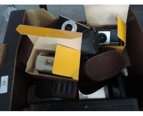 A box of miscellaneous including vintage cameras, flatware etc