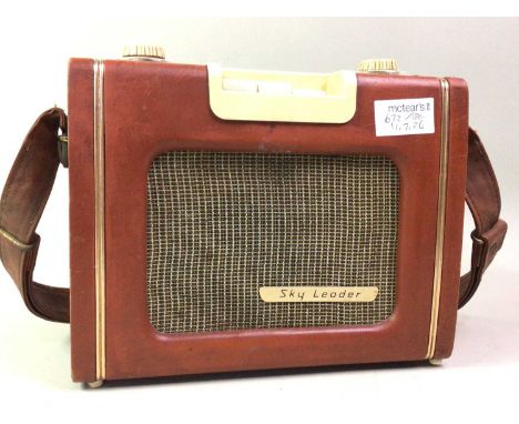 GRUNDIG RADIO, AND OTHER ITEMS along with a Sky Leader radio, a group of silver plated flatware and a wicker picnic hamper, a