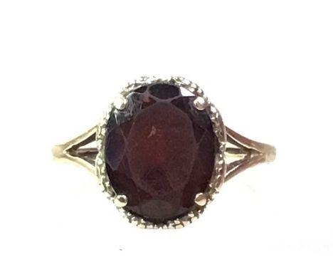 NINE CARAT GOLD DRESS RING, AND A FASION WATCH  the ring with garnet, along with a lady's dress watch by RecordQty: 2