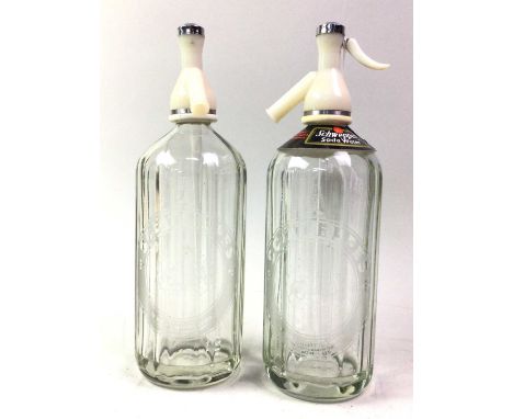 TWO SODA SYPHONS, ALONG WITH FURTHER ITEMS comprising a jardinere, water jug, pair of candlesticks and a tea light holder
