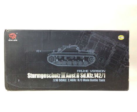 REMOTE CONTROL STURMGESCHUTZ III BATTLE TANK, AND OTHER ITEMS  the battle tank in original box, along with a Steve McQueen WW
