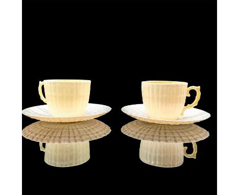 A set of cream-colored teacups (2) and saucers (2). Belleek backstamp. Dimensions of the teacups: 3"L x 2.25"W x 2"H. Dimensi