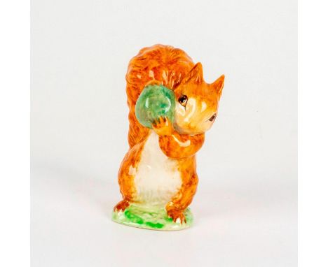 Depicts a light brown squirrel holding a large green nut. Beswick backstamp. Dimensions: 2"L x 2.5"W x 3.5"HManufacturer: Bea