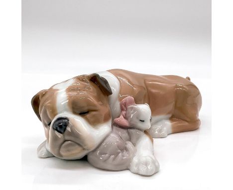 Glossy finish porcelain figure depicting a bulldog and cat sleeping peacefully. This item has its original box. Box measures: