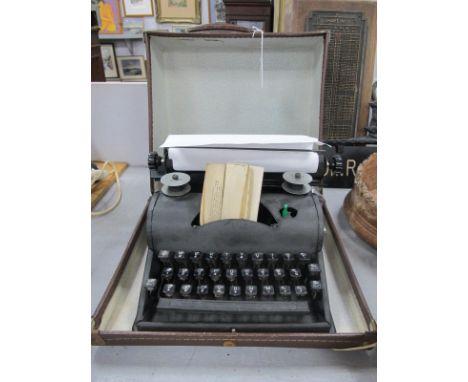 Vintage 'Homewriter' Typewriter, in a brown case.