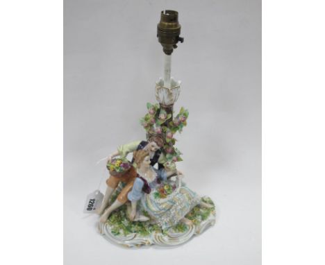 Italian Capo di Monte Porcelain Candlestick,featuring Regency courting fruit and flower pickers on naturalistic base bearing 