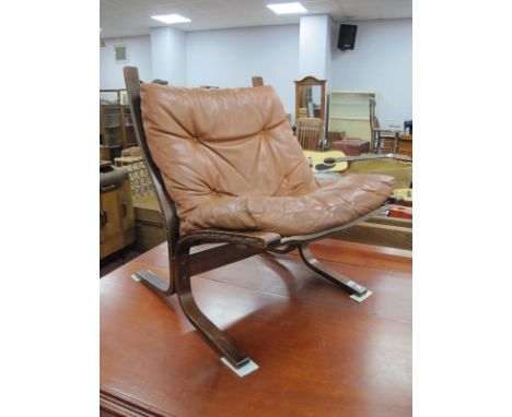 Imngmar Relling (1820-2002), Siesta Chair, circa 1970, laminate framed of curved'S' form, with tan button applied leather slu