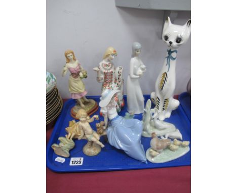 Ukranian Figure of Seated Lady, 21cm high, larger cat probably Italian, Nao and other figurines:- One Tray.