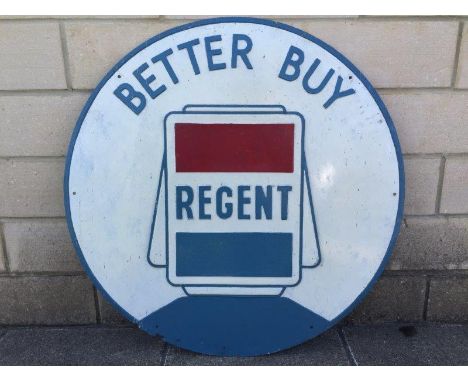 A Regent embossed aluminium advertising sign with central globe motif, 32" diameter.