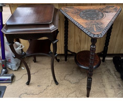 An early 20th century mahogany lamp table of square form with scrolling legs and an undertier together with a carved oak tria