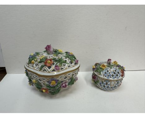 A Dresden porcelain Pot pouri box and cover encrusted with flowers and leaves together with a smaller example