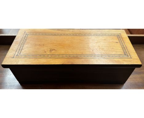 A music box, with an inlaid rectangular lid enclosing a 15.5cm cylinder potentially playing six aires